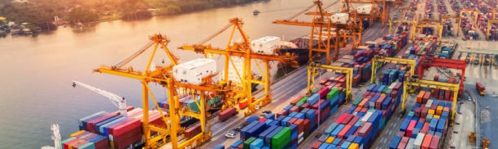 Logistics and transportation of Container Cargo ship and Cargo plane with working crane bridge in shipyard at sunrise, logistic import export and transport industry background